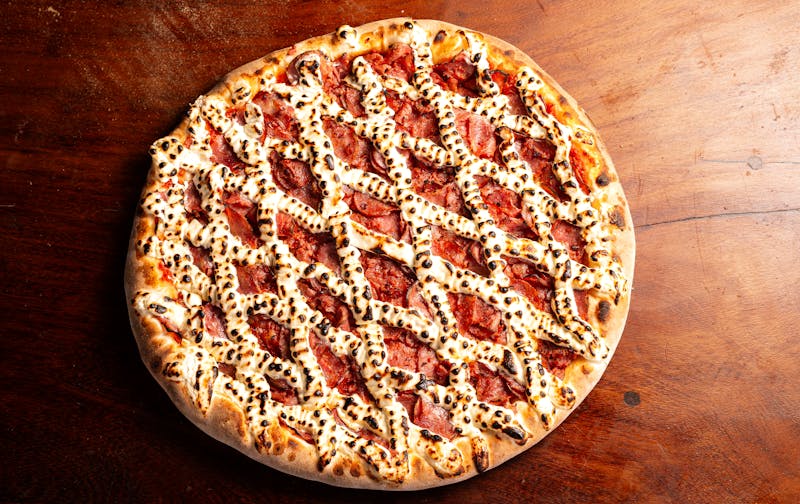 Four cheese pizza at pizza factory